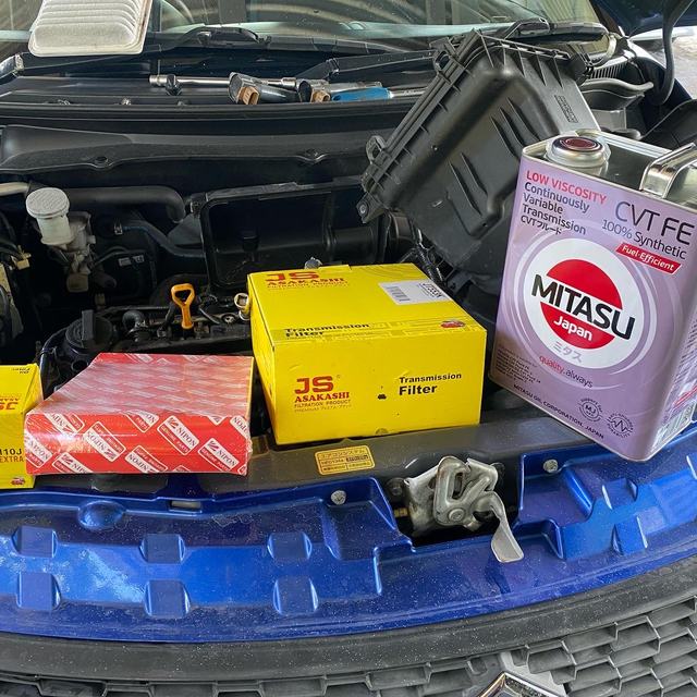 Service parts and oil ready for a car service