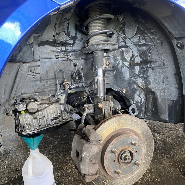 Brake and suspension work on a blue car